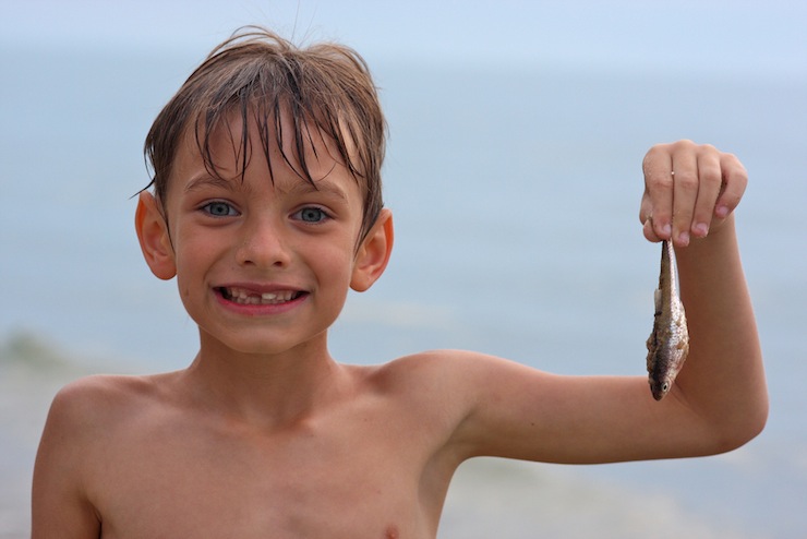 Top 10 Summer Poems Boy on Beach with Fish