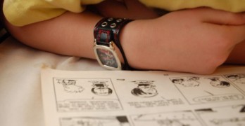 Top 10 Calvin & Hobbes Poems - boy reading Calvin & Hobbes comic