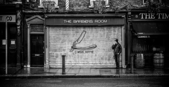 man outside barber shop-Philip Levine Kristen Dupard Discuss What Work Is