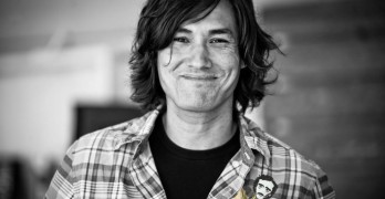 Poem in Your Pocket day man with plaid shirt and pocket poets