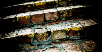 The Art of Stillness Book Club - brick stairs in the dark