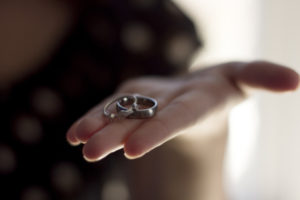 Wedding rings in hand, happy marriage