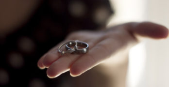 Wedding rings in hand, happy marriage
