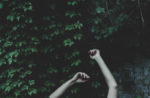 hands with vine wall