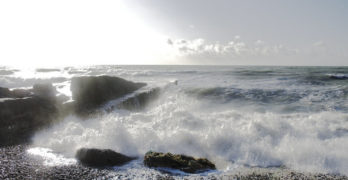 Waves crash on rocks