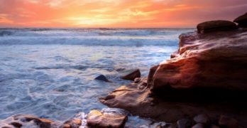 sunset over rock promontory