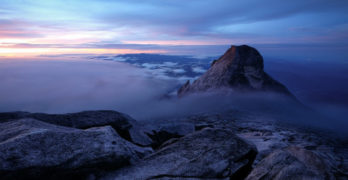 Pandemic Journal - photo of Mt. Kinabalu above misty clouds