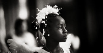 Black girl dressed as angel