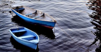 two-blue-boats-on-river