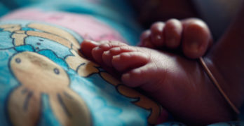 baby feet on bunny blanket