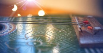 sunrise bokeh over guitar