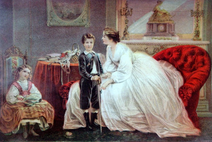 a young boy is scolded by his mother while his sister looks on 