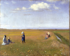 children play in a field of flowers