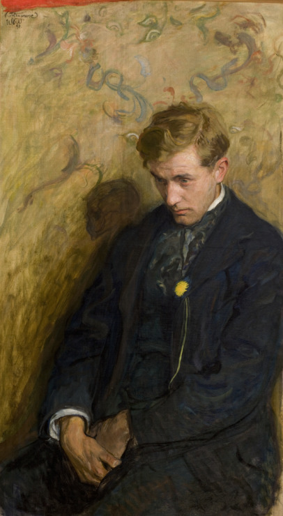 man sits looking gloomy in a pensive thought 