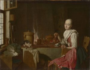 woman sits at a table pouring coffee