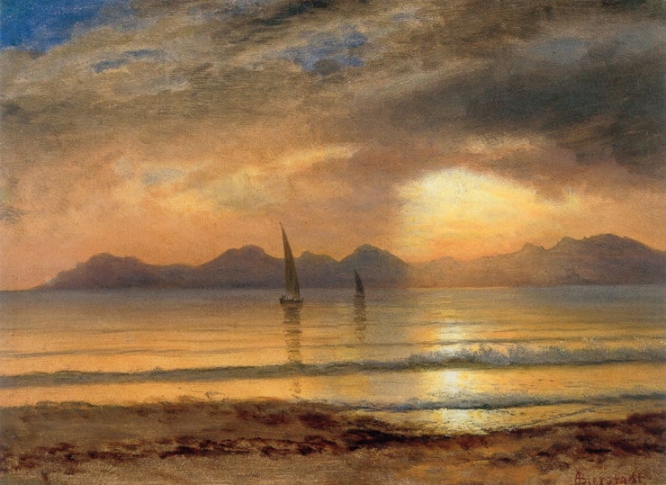 sailboats on the water during sunset