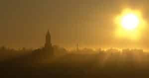 photograph on a sunrise behind a church