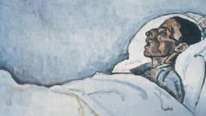 man lies in his deathbed