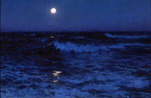 the moon glows over the ocean at night