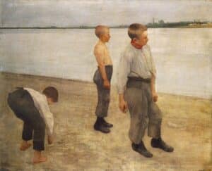 boys stand on the shore tossing pebbles into the water