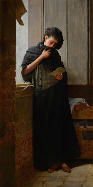 a woman is crying reading a letter 