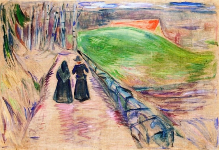 two figures seen walking down a road