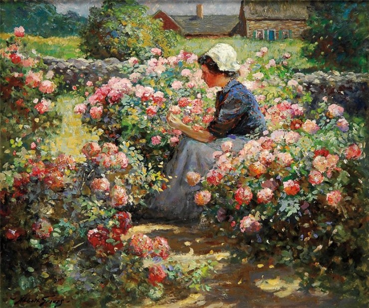 woman sits and picks rose flowers