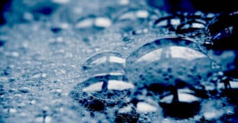 soap suds on dark surface
