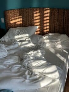 bed with white linens